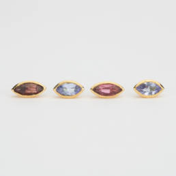 Earrings Marquise shaped tanzanite and Garnet in 18K yellow gold.